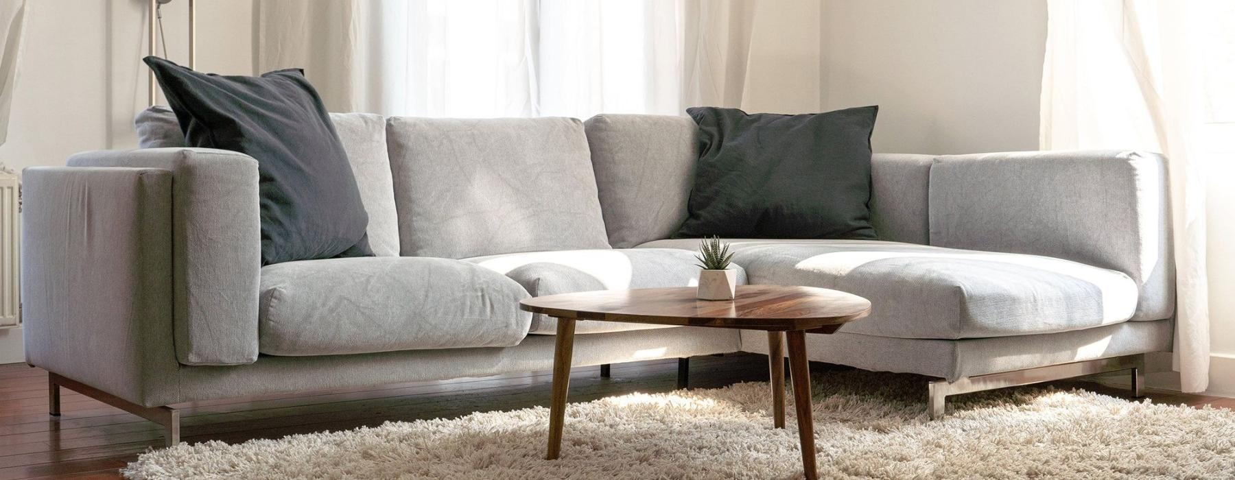 oversized windows brighten spacious, furnished living room